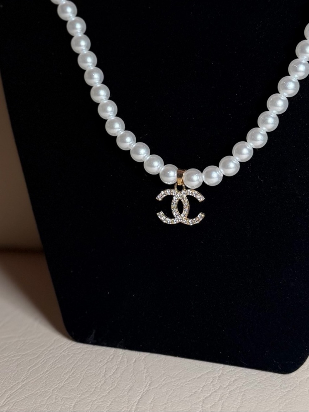 White faux pearl necklace.